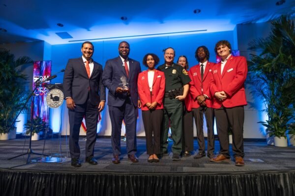 Polk State Presents Congressman Byron Donalds With Crystal Eagle